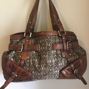 Vintage DKNY satchel bag w/real leather trim, straps and accent.